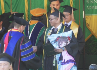 American Otaku Attends College Graduation Accompanied By His Anime Girl Huggy Pillow
