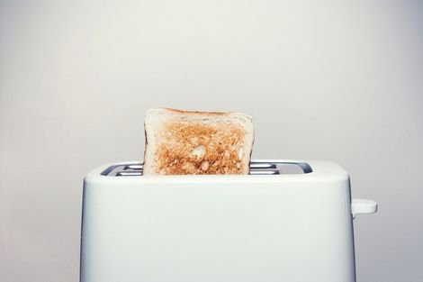 Bread popping out of toaster